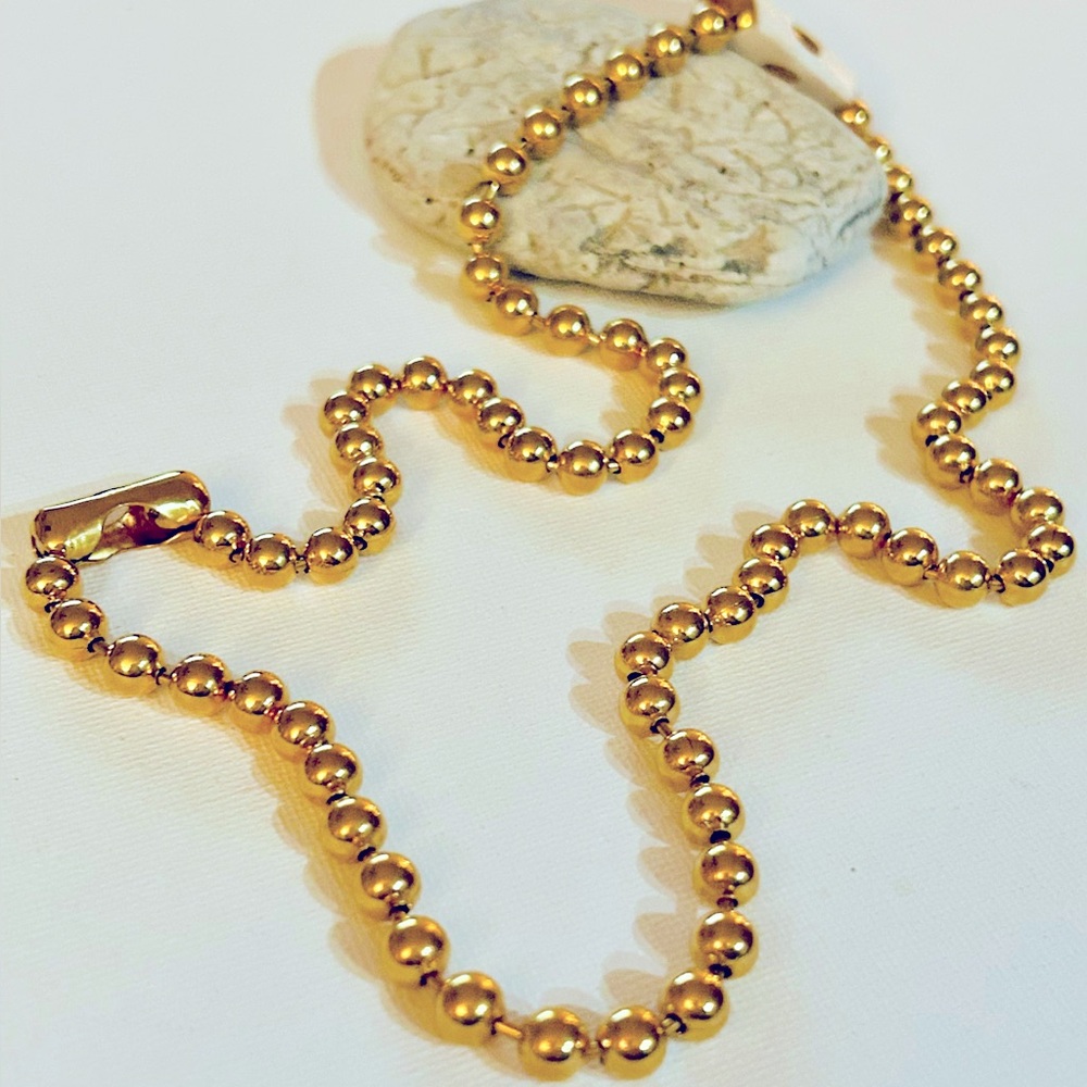 Ball chain gold tone stainless steel 23.5” length, width 6 mm.